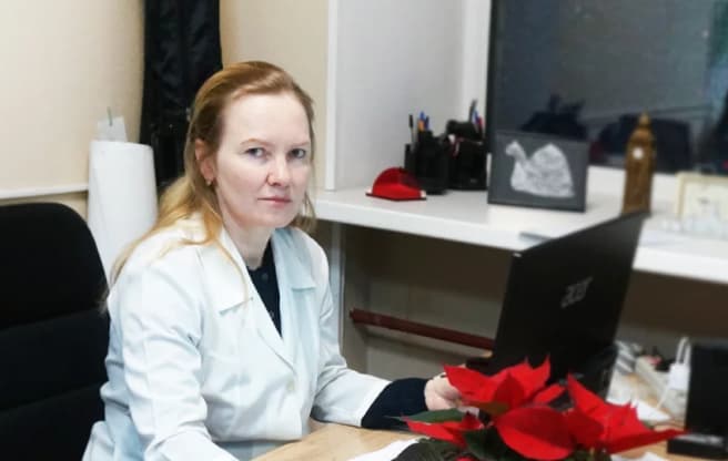 A laboratory employee at her workstation